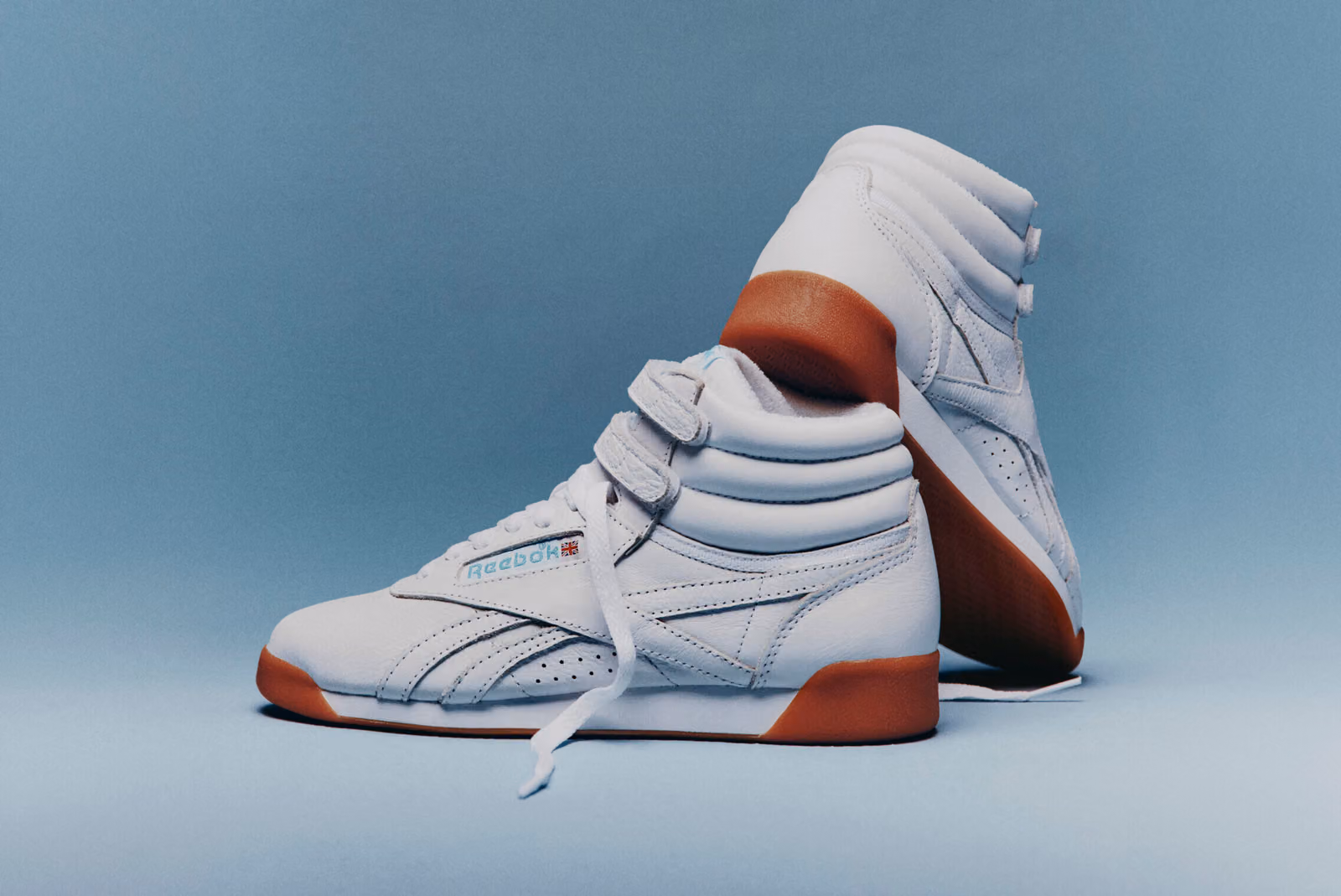Karol G Teams Up with Reebok, Bringing the Freestyle Hi Back to Its White-and-Blue Roots