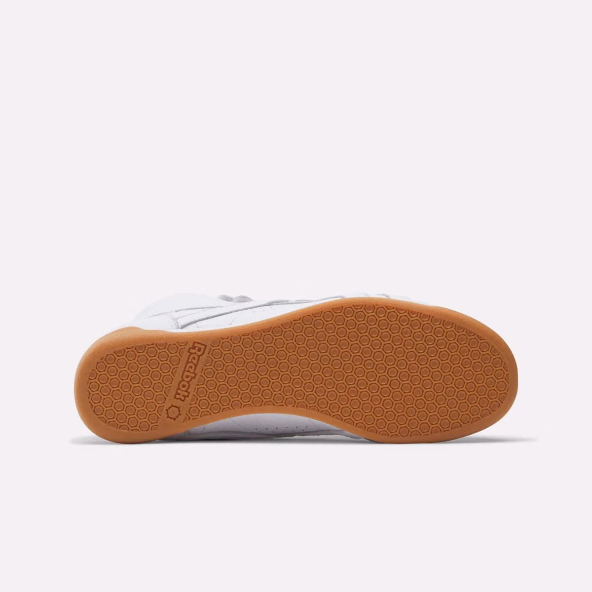Karol G Teams Up with Reebok, Bringing the Freestyle Hi Back to Its White-and-Blue Roots