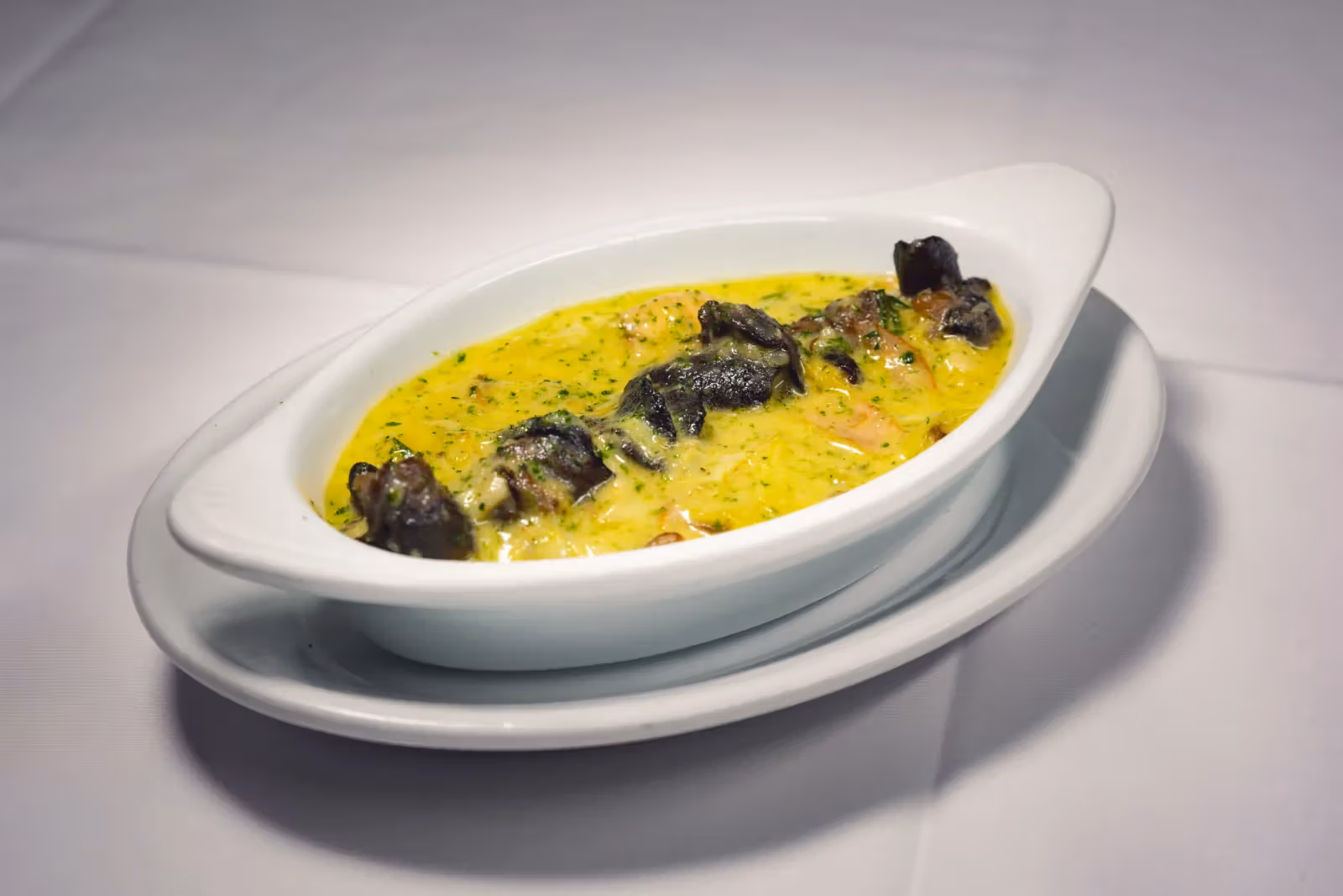 Garlic escargot with artichoke dish