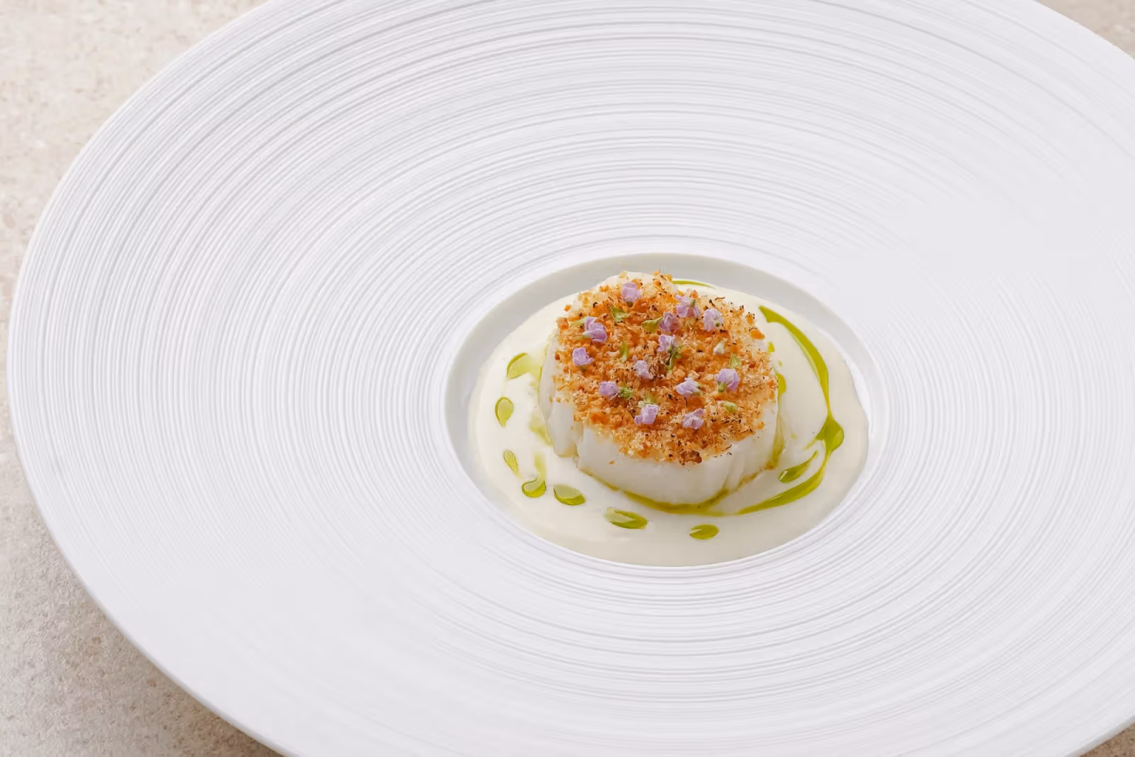 Main course plating of Murray cod with soy bean crumbs