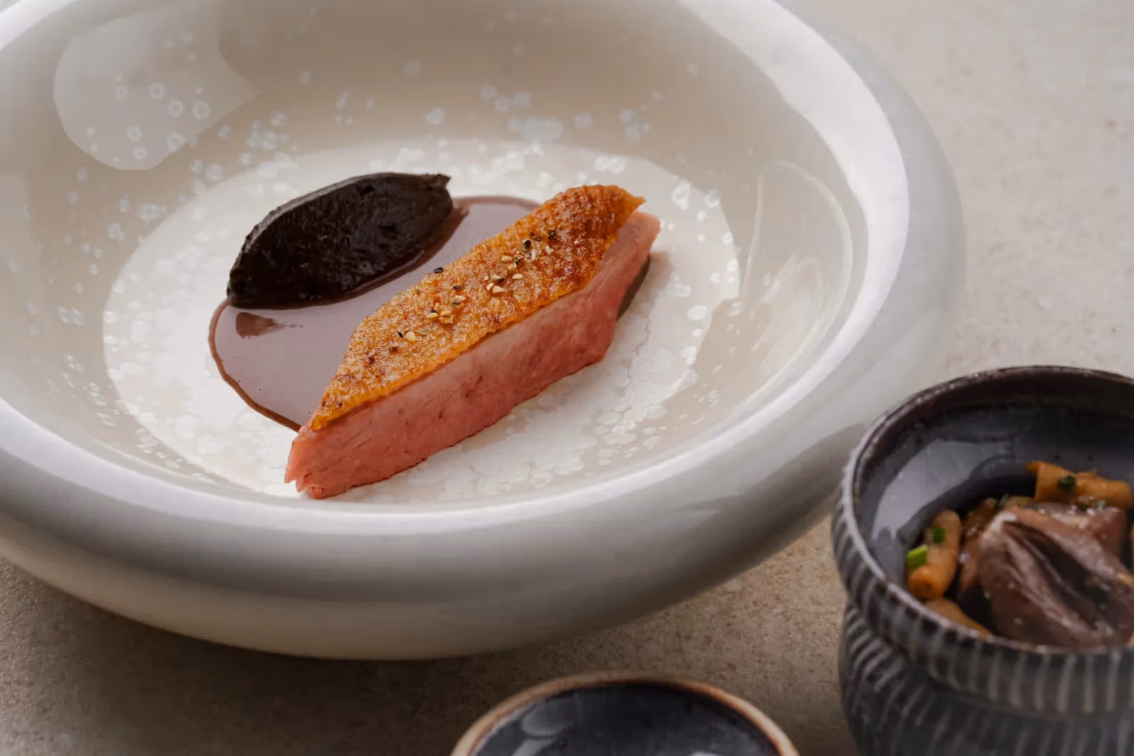 Main course plating of rose duck with aigamo rice