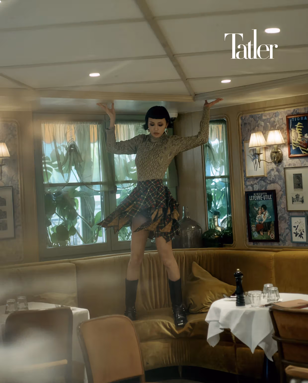 Gold knit top, draped plaid skirt, all by Louis Vuitton
