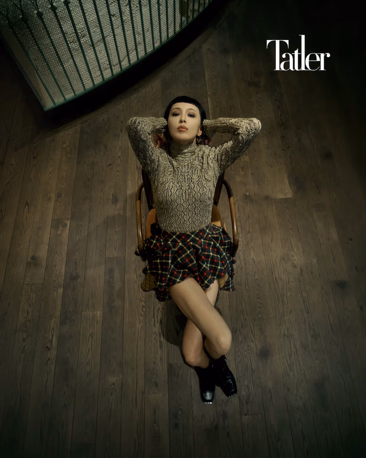 Gold knit top, draped plaid skirt, all by Louis Vuitton