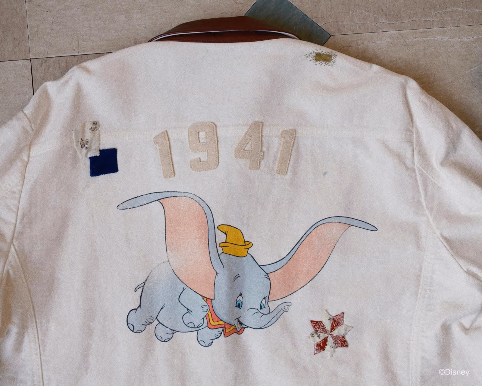 Dumbo, 1941 lettering and repair details on KHOKI jacket