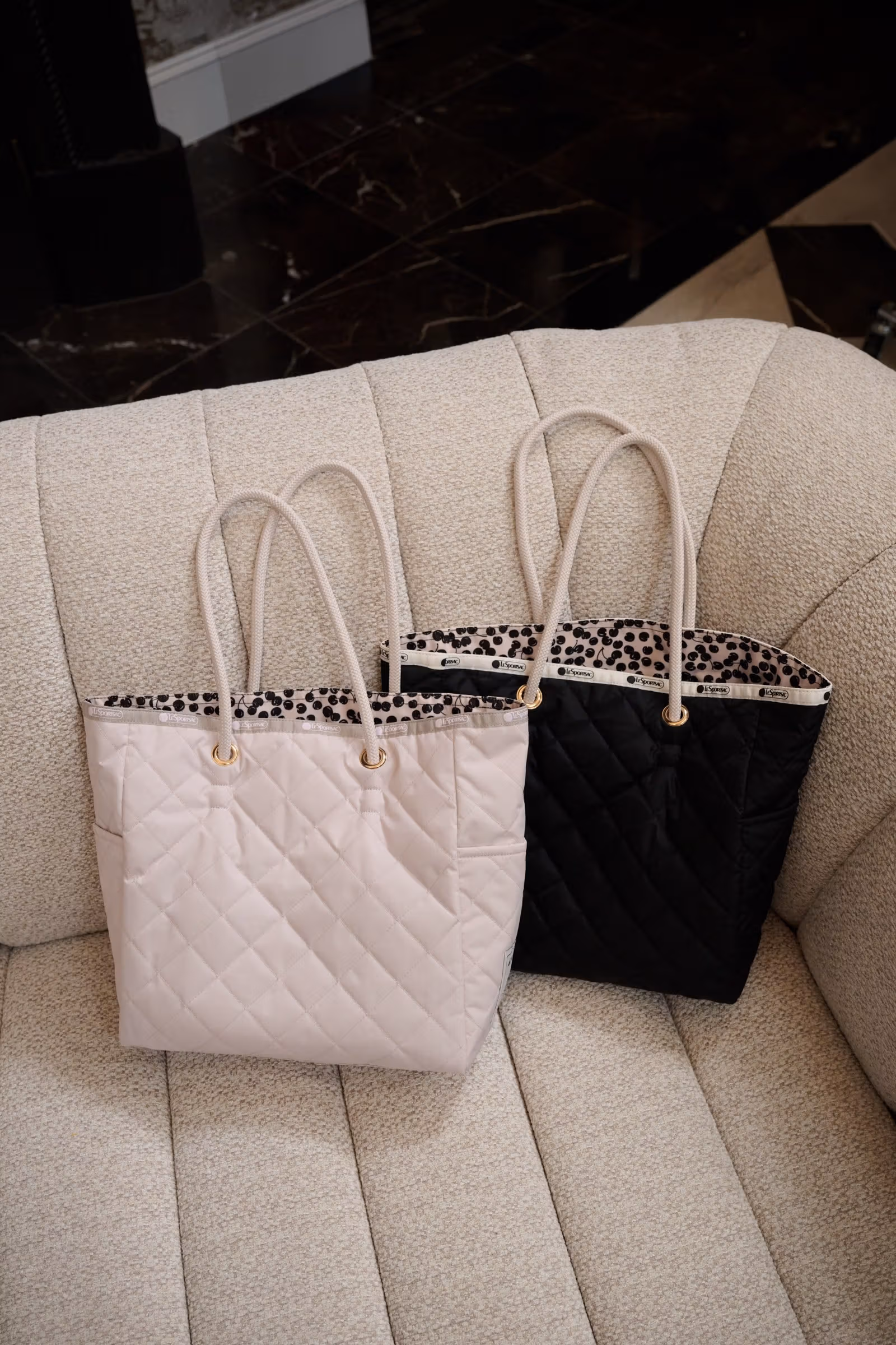 Her lip to with LeSportsac reversible tote