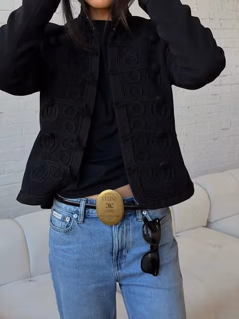 Decoration and fastening of black jacket