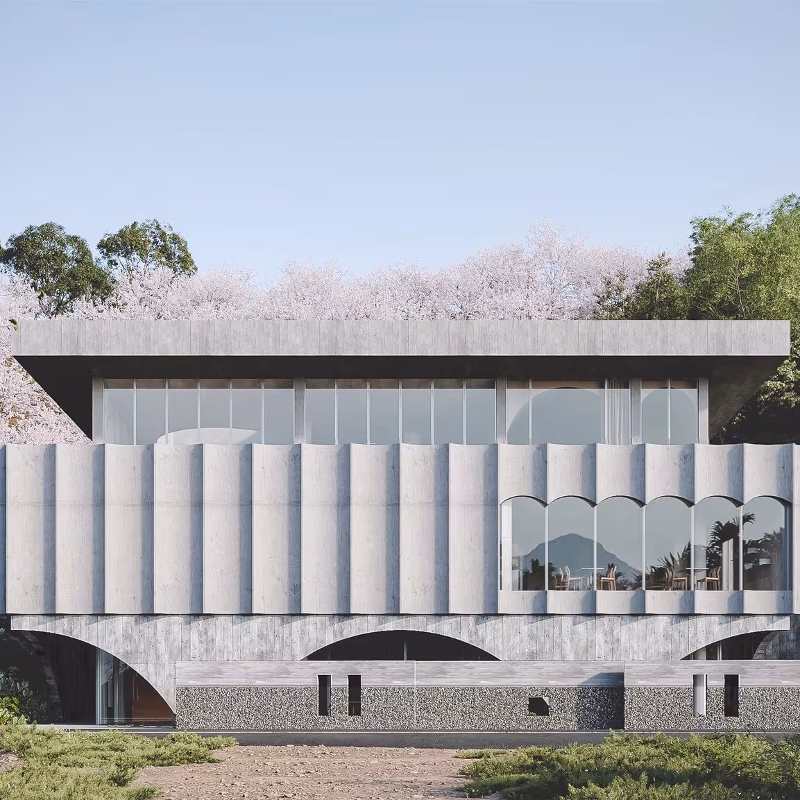 白い屋根と連続する立面が建物の輪郭をつくる