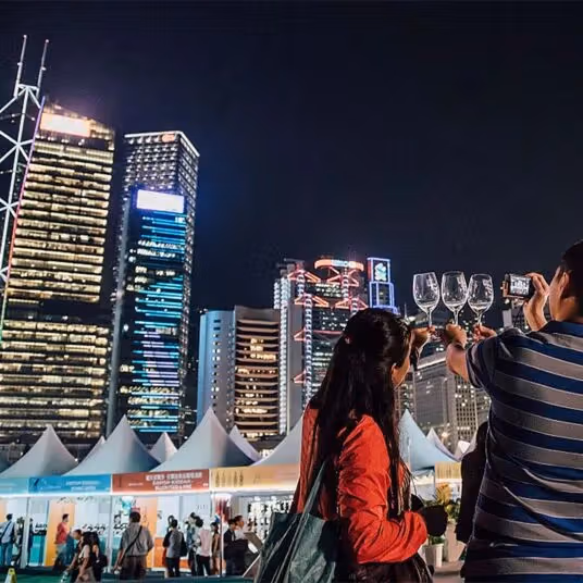 A reference image of a waterfront dining event at night