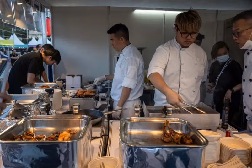 A reference image of food preparation at festival stalls