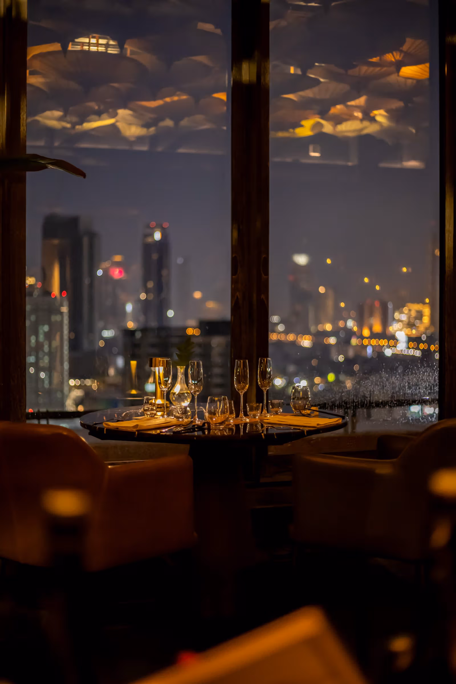 A window-side table and city view in TAAN’s official gallery