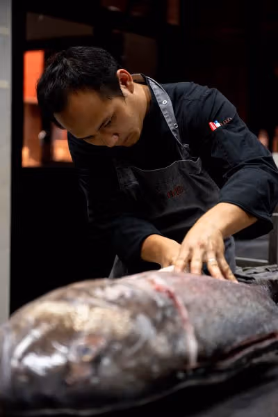 Kitchen preparation in TAAN’s official gallery, not a specific current dish