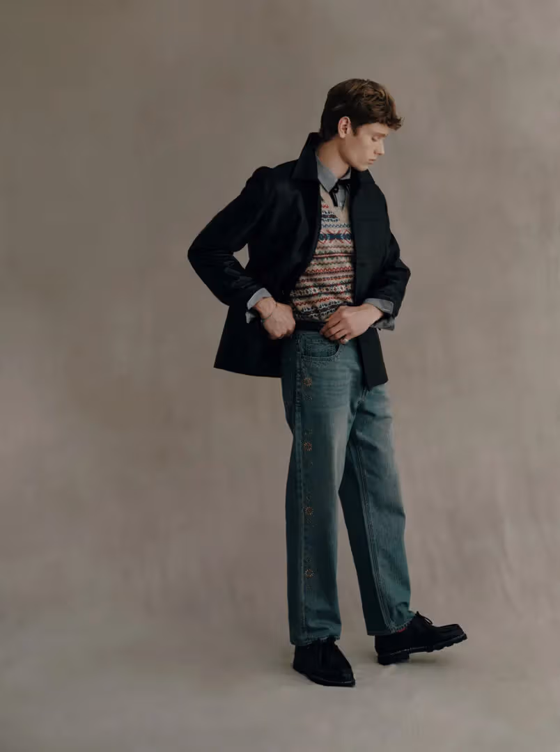 A full HAZZYS outfit combining a dark outer layer with denim