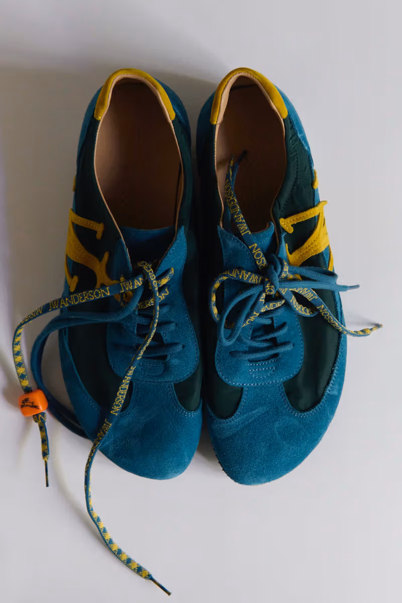 JW Anderson previews Run Rabbit sneakers in teal and ochre, with a tiny rabbit charm