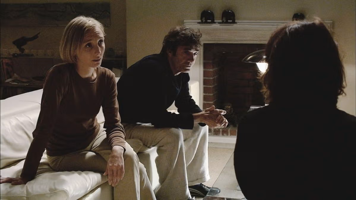 A scene from Caché shows the relationships between its characters.