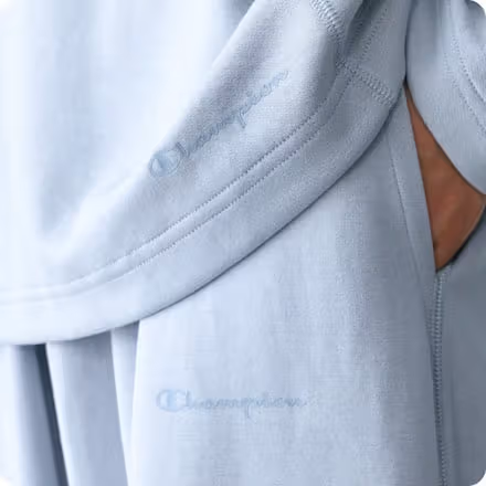 เครื่องหมายสีเดียวที่ชายเสื้อและกางเกง Champion เทา