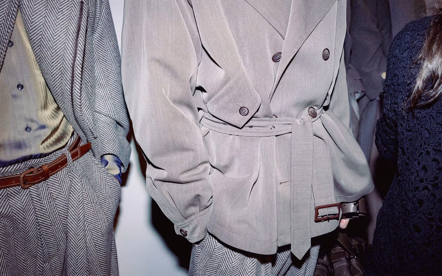 Details of a grey menswear jacket, shirt and waist