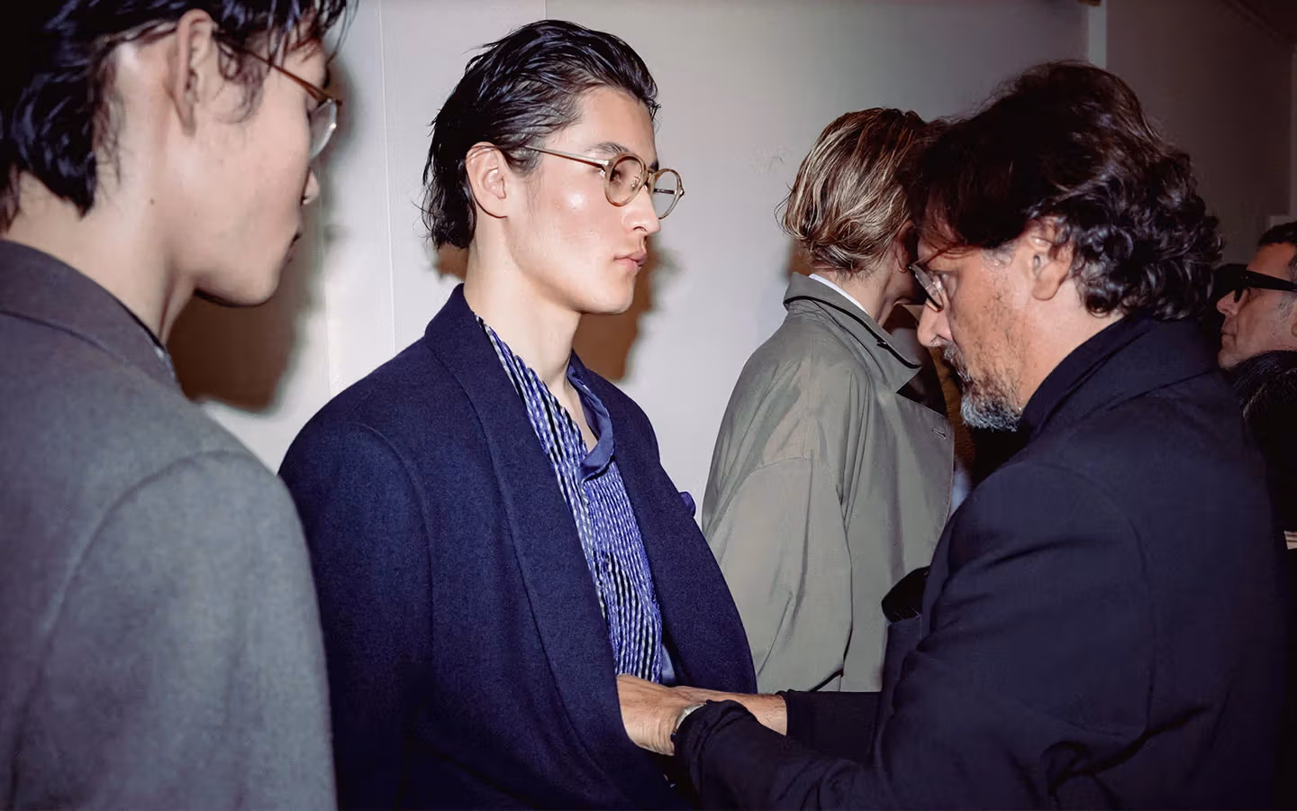 Models and staff backstage at a Giorgio Armani runway show