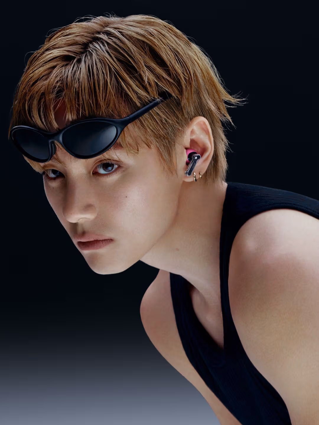 V wears Ear (3a) in a brand campaign image.