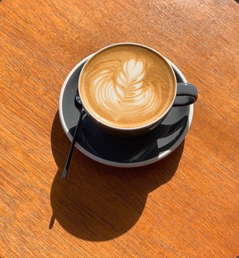 Coffee and a wooden tabletop at Jeumeu Roastery.