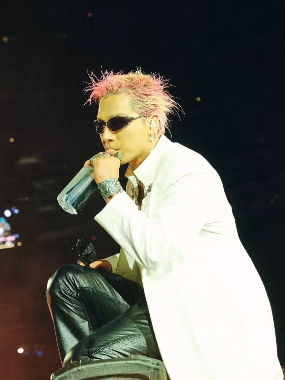 Taeyang extends longer pink-blond sections around the sides and nape.