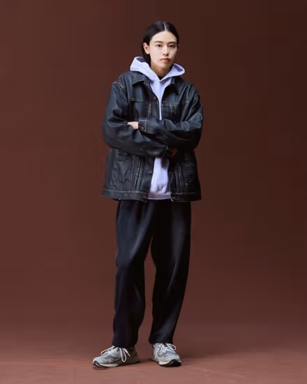 Black Liberaiders leather jacket over a pale purple hoodie