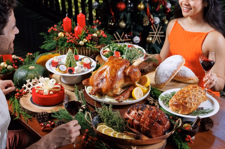 Roast poultry, bread and desserts before Christmas decorations