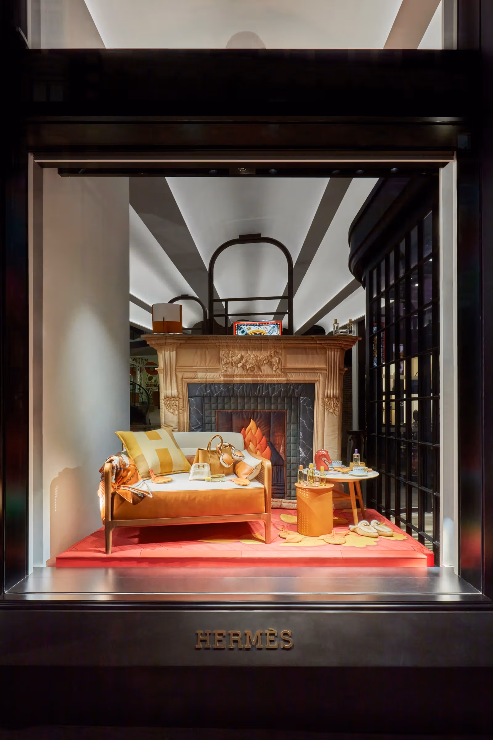 Fireplace and sofa scene in the Hermès London window