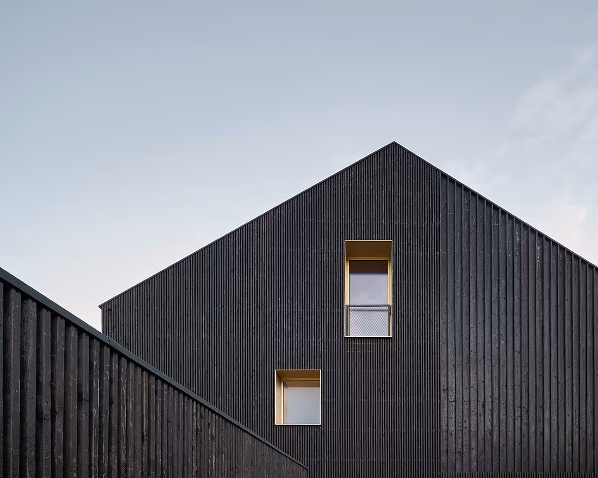 House in Process black wood and gold window reveals