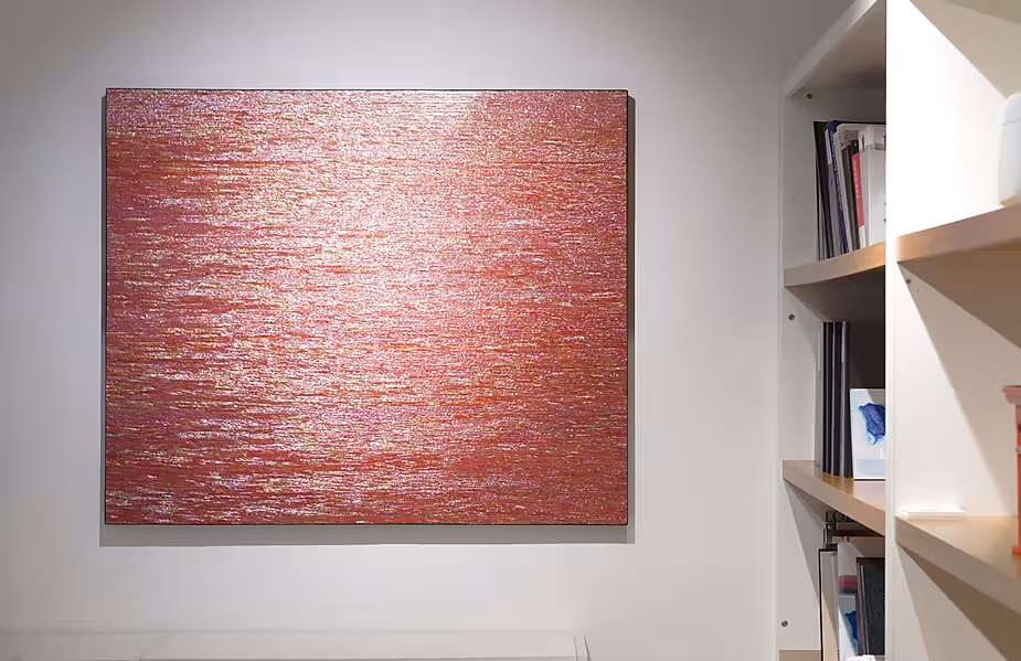 Dense horizontal reflective marks cover a square reddish work beside a white bookshelf.