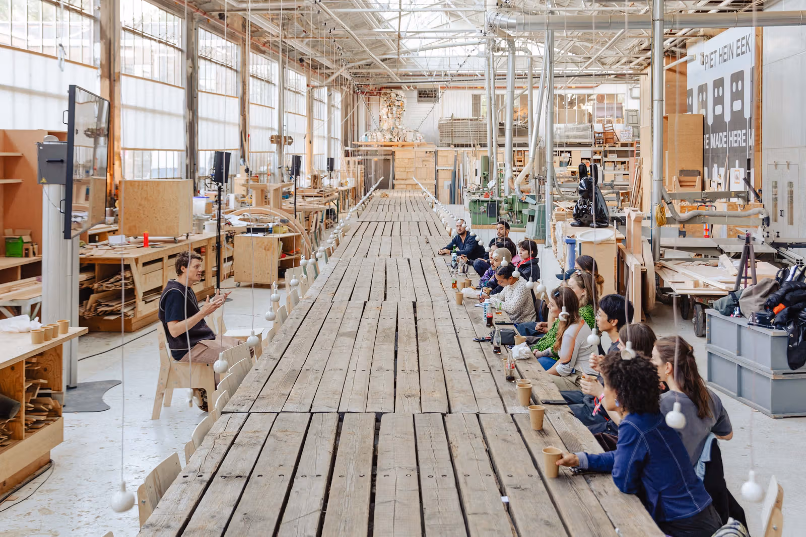 Long table and participants at the Dutch Design Awards in a workshop