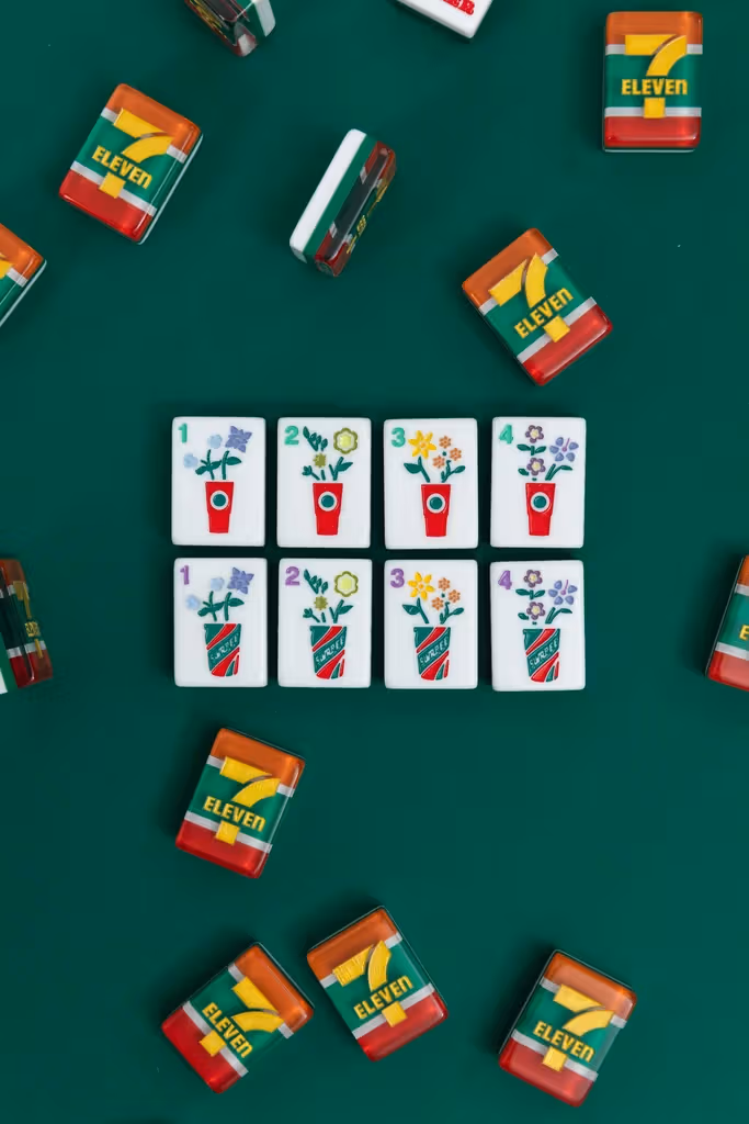 Mahjong tiles with convenience-store drinks and flowers