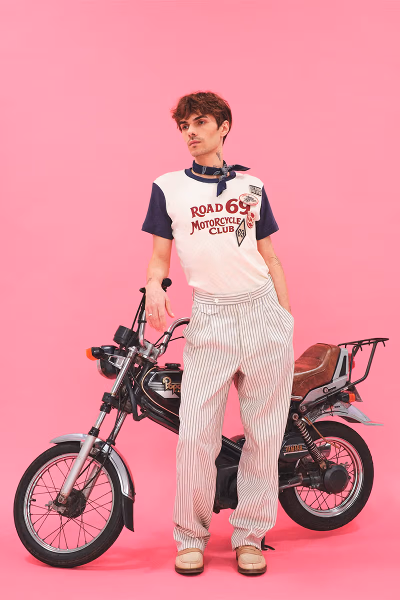 Road 69 top and white trousers motorcycle studio image