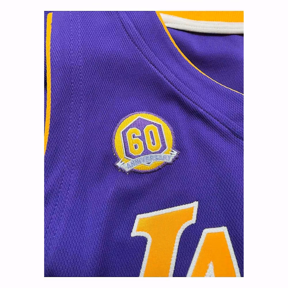 Golden 60th-anniversary patch and neckline on a purple jersey