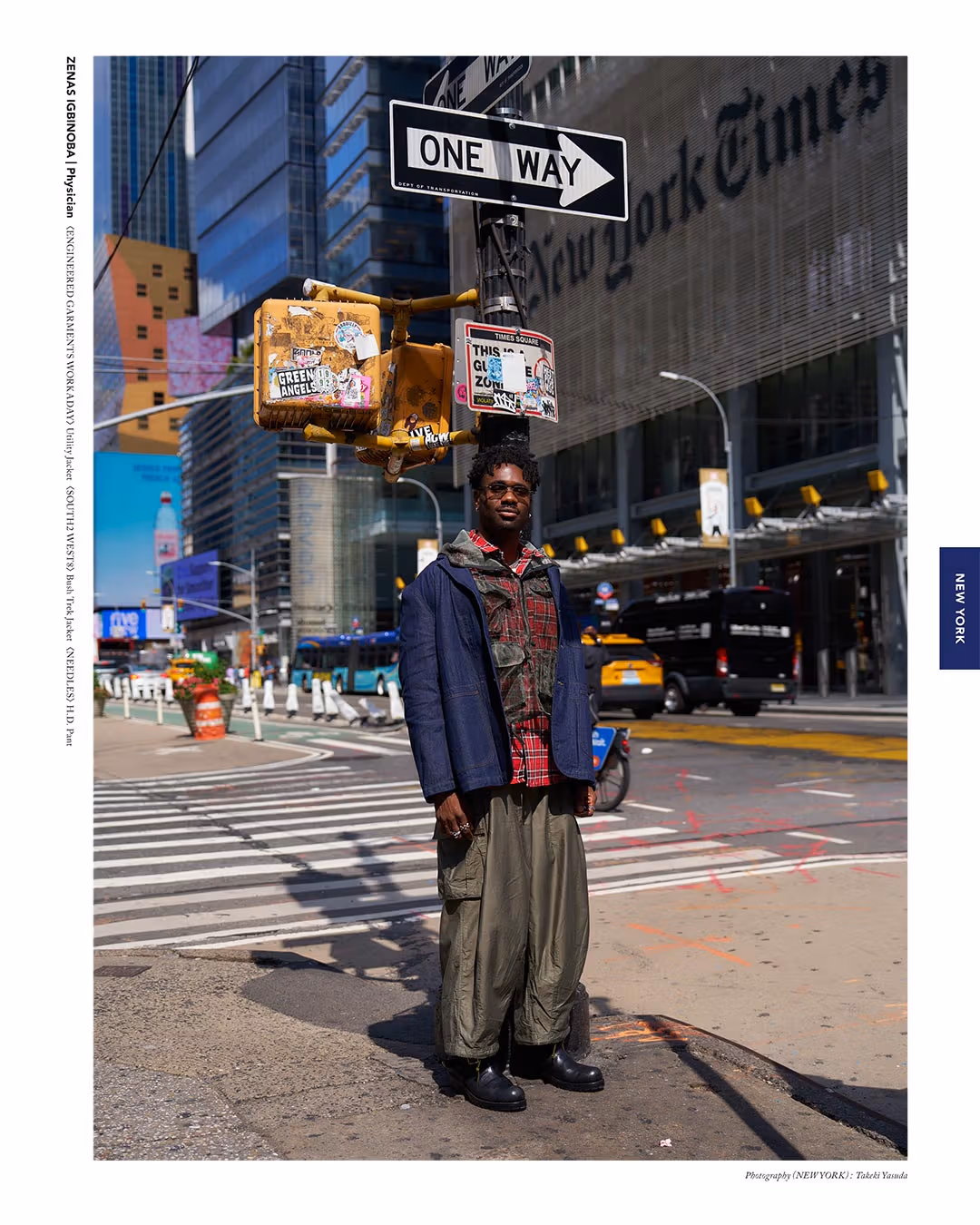 Person wearing a dark jacket and wide trousers at a New York street corner
