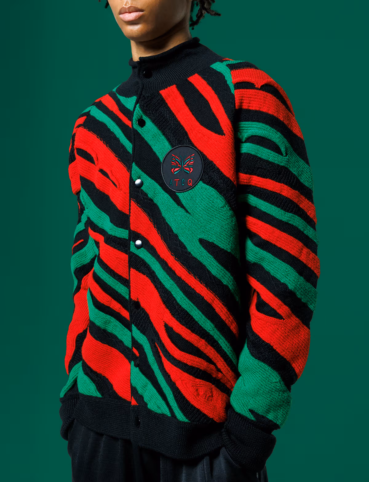 Buttons and neckline of the red-and-green striped cardigan