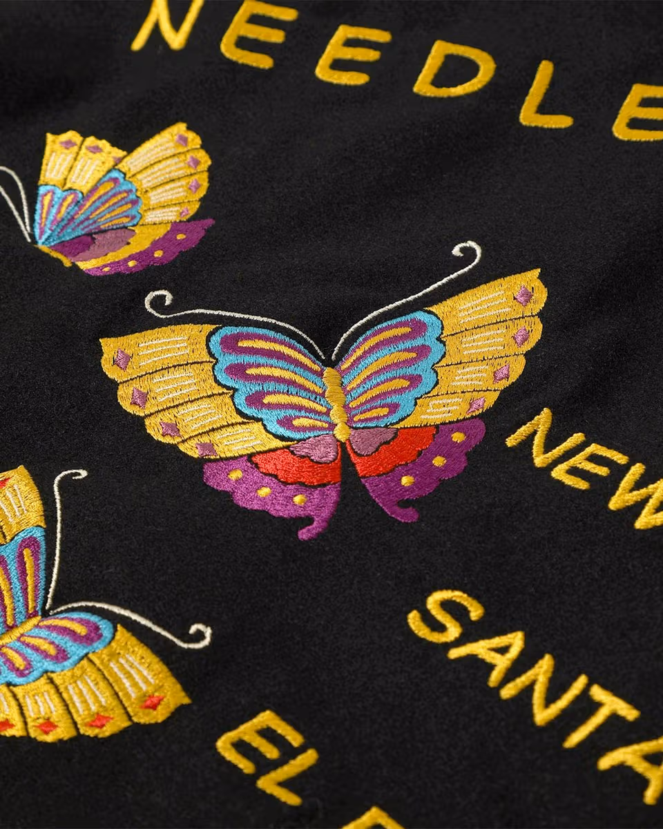 Butterfly embroidery detail on the jacket back