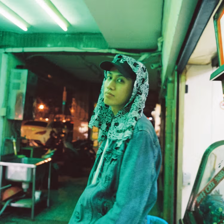 Green-lit portrait on JJJ’s HIKARI album cover