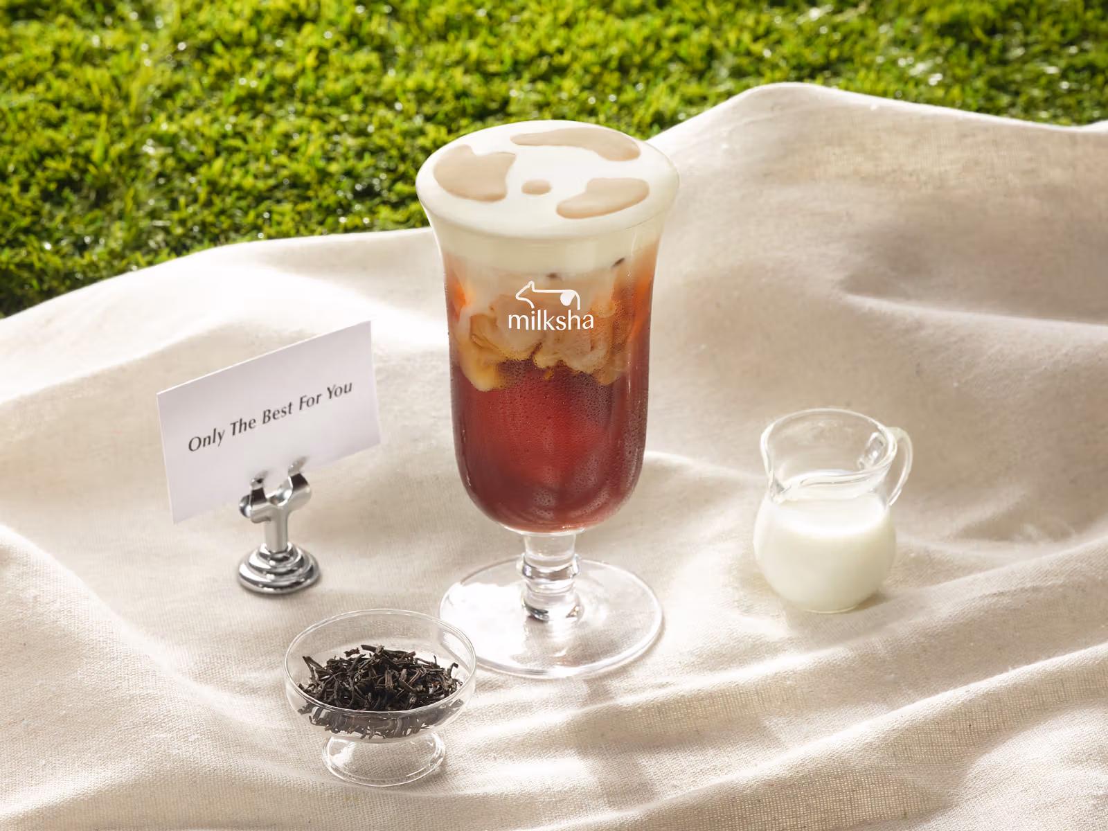 Nabei Smoked Cream Tea publicity image with cow-like spots on the cream.