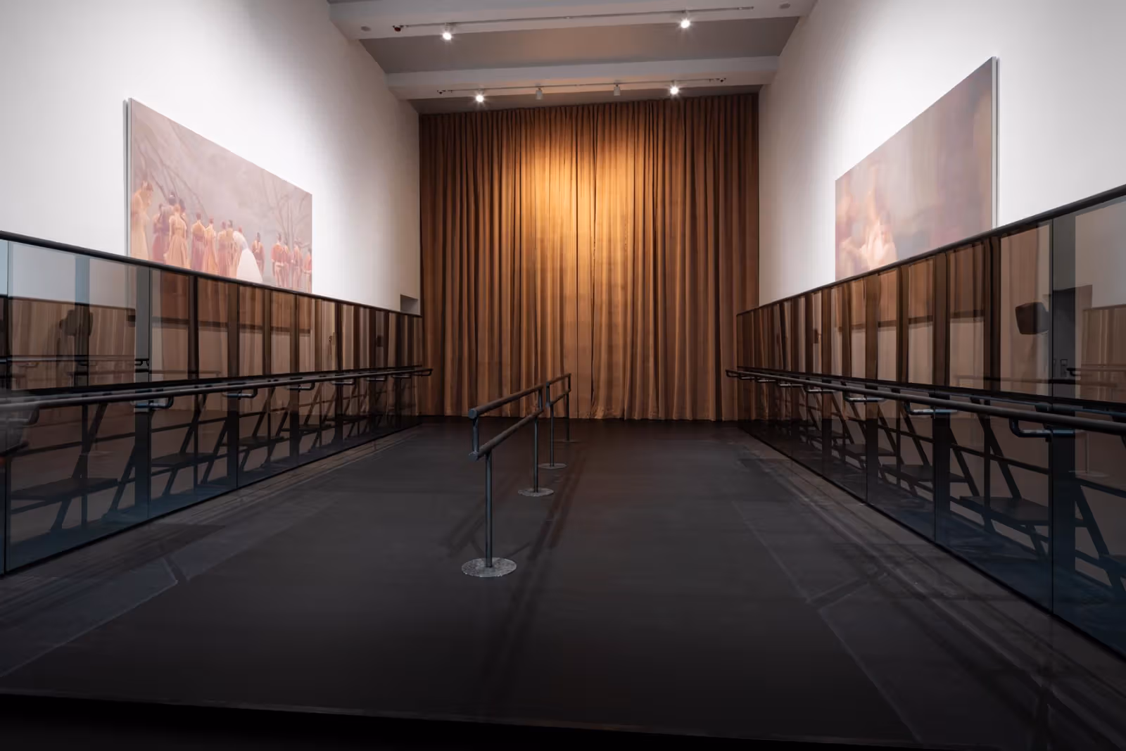 House of Swans, smaller third-floor gallery: a gold-coloured curtain, images and rails form a passage.