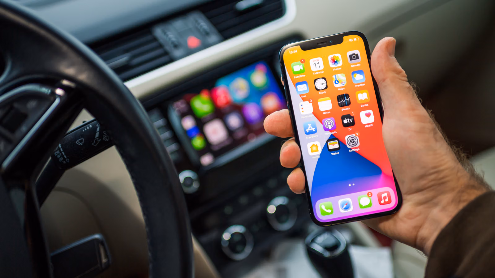 Wired vs. Wireless CarPlay: Same Features, Different Headaches (Disconnects, Dead Batteries, or Cluttered Cupholders)