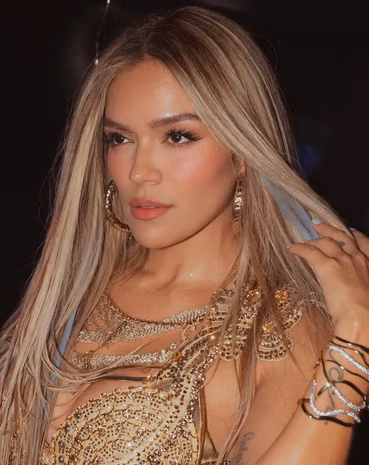 Karol G Is Feeling Blue…In a Good Way